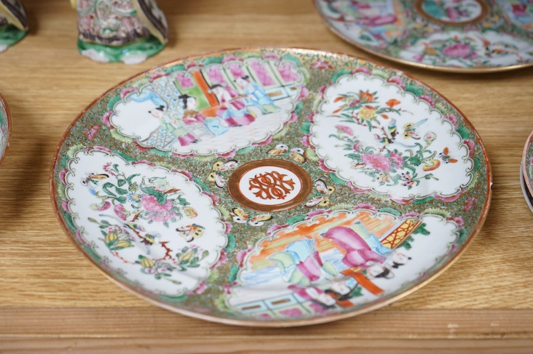 Five Chinese famille rose plates, Guangxu period and a pair of Chinese figures, 25cm in diameter. Condition - fair to good